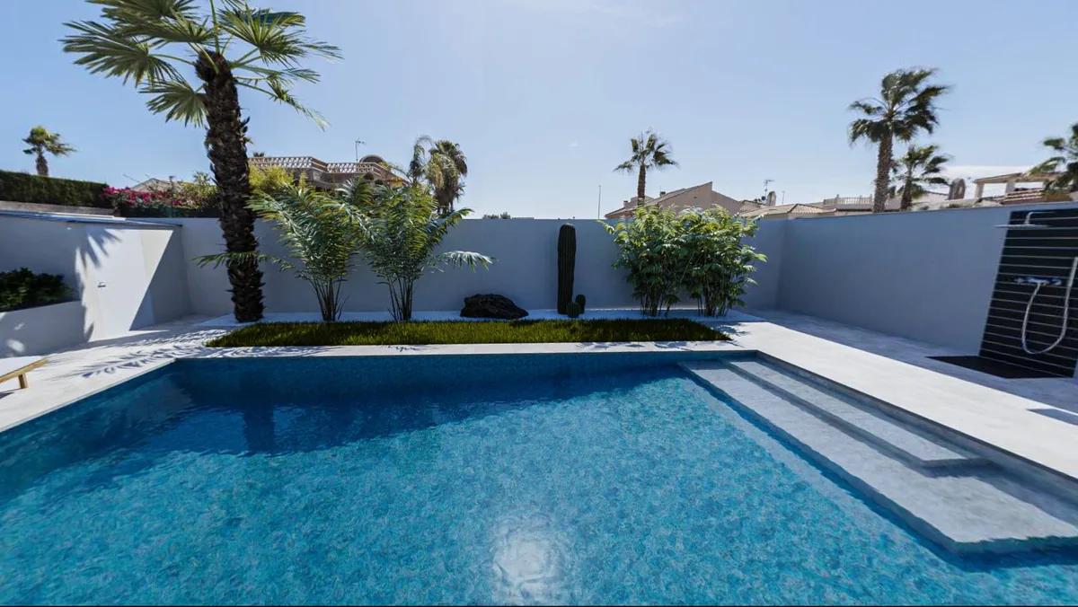 Piscina y jardín de Casa Oasis al atardecer