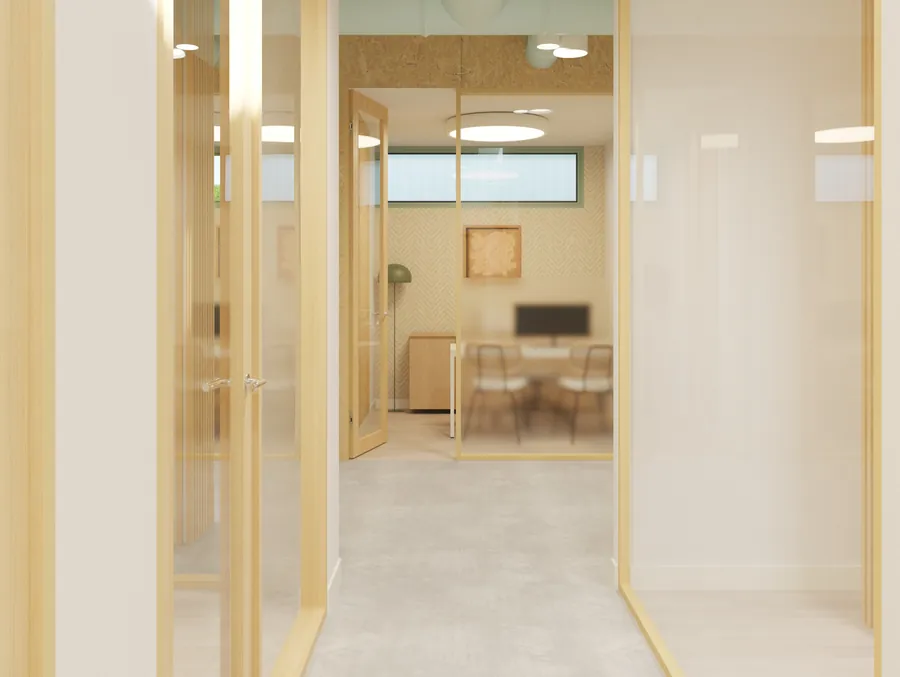 Pasillo de los despachos, con los cerramientos de vidrio y madera