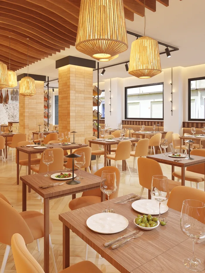 Comedor del restaurante Montecristo, con techo de listones de madera y lámparas colgantes